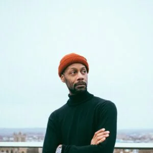 man standing near balcony